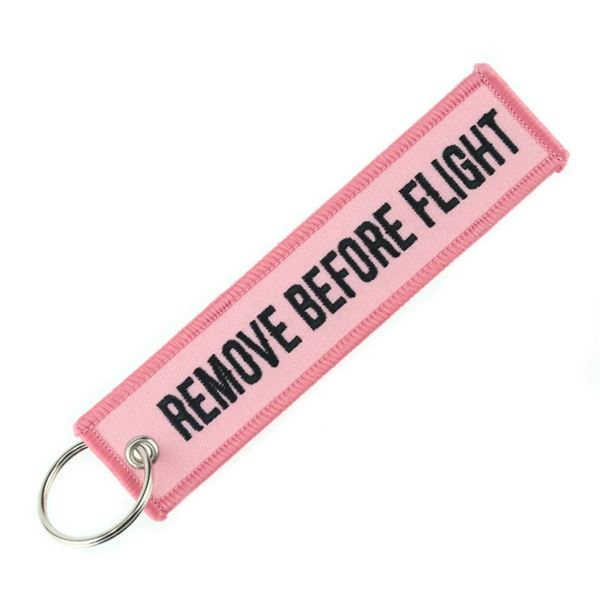 Keyring REMOVE BEFORE FLIGHT light pink